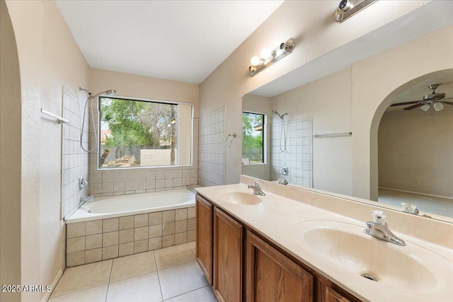 bathroom featuring a sink, tile patterned floors, and plenty of natural light