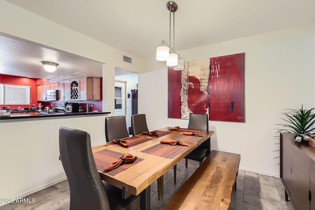 3924 E Cortez St, Phoenix, AZ 85028 - dining space featuring wood-type flooring