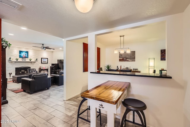 3924 E Cortez St, Phoenix, AZ 85028 - dining area featuring a ceiling fan, a fireplace, wet bar, and recessed lighting