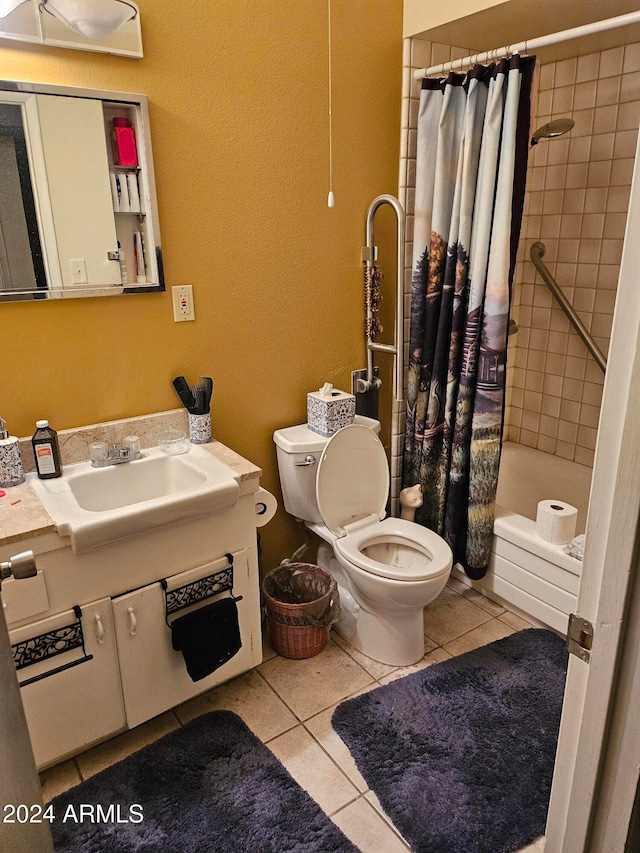 full bathroom featuring toilet, tile patterned flooring, sink, and shower / bath combo with shower curtain