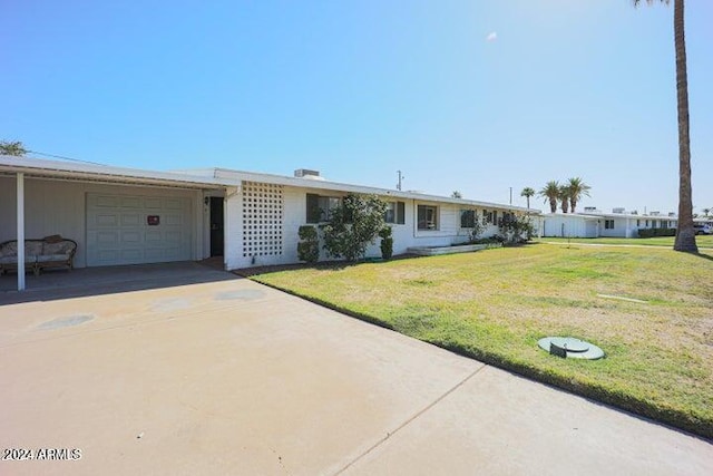 ranch-style house with a front lawn and a garage