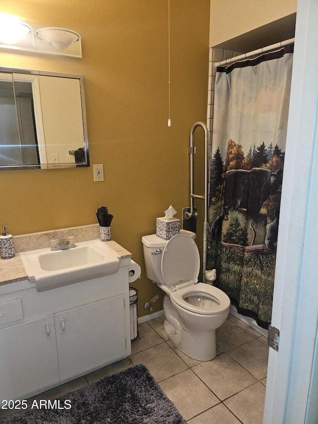 bathroom featuring toilet, a shower with curtain, tile patterned floors, and vanity