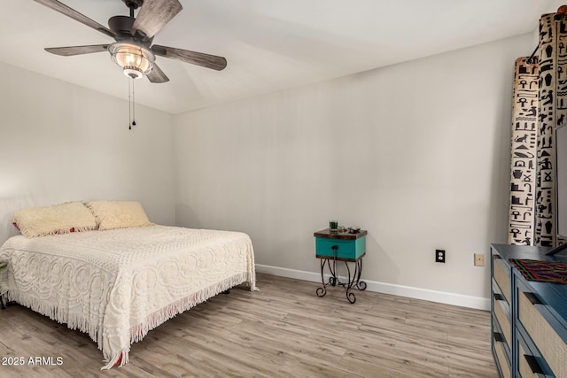 bedroom featuring ceiling fan and light hardwood / wood-style floors