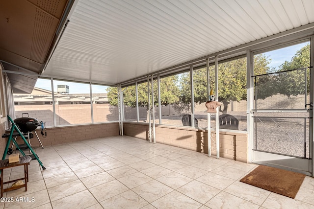 unfurnished sunroom featuring plenty of natural light