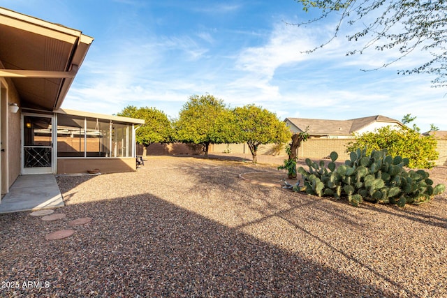 view of yard featuring a sunroom