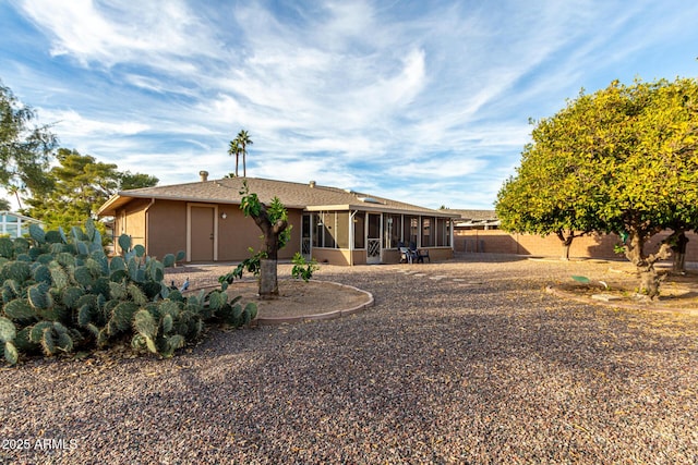 rear view of house with a sunroom