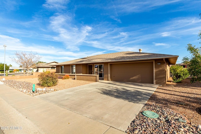 ranch-style house featuring a garage