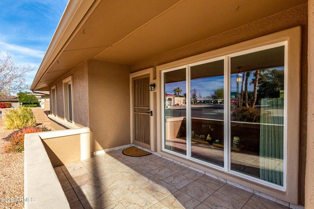 entrance to property featuring a patio