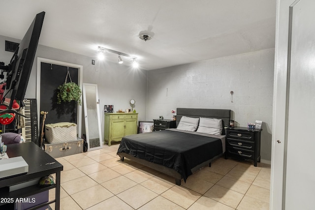 bedroom featuring light tile patterned floors and visible vents