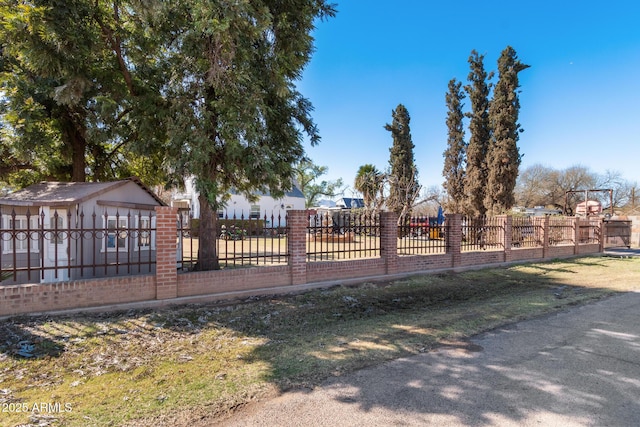 view of jungle gym with a fenced front yard