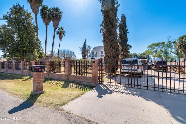 view of gate featuring fence