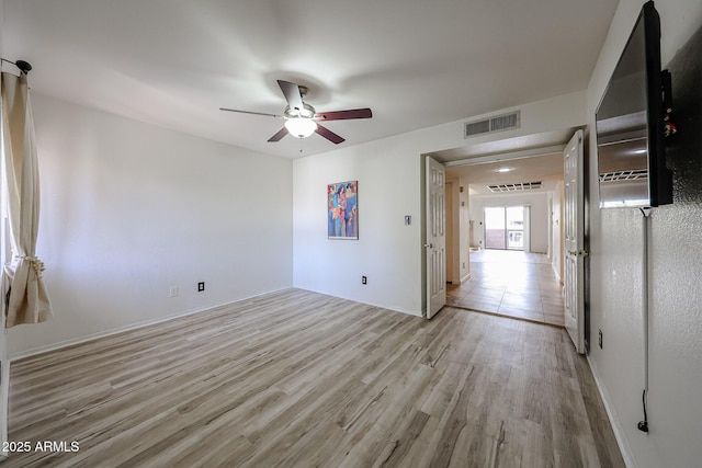 unfurnished room with light hardwood / wood-style floors and ceiling fan