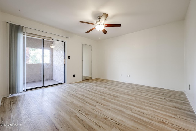 empty room featuring ceiling fan and light hardwood / wood-style floors