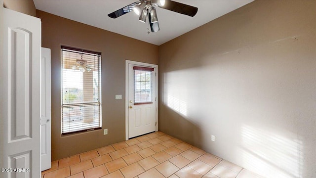 entryway featuring ceiling fan and light tile patterned floors