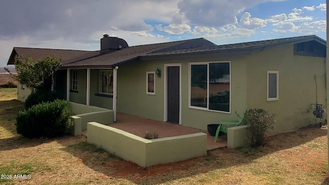 1005 W Purdy Ln, Bisbee, AZ 85603 - rear view of house with stucco siding and roof with shingles