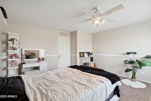 bedroom featuring carpet, visible vents, baseboards, and ceiling fan