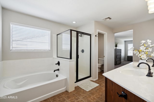 bathroom with toilet, a garden tub, a shower stall, and visible vents