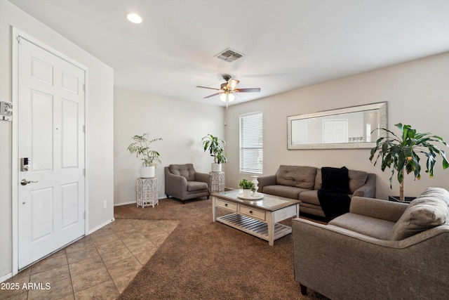 carpeted living room with visible vents, baseboards, a ceiling fan, recessed lighting, and tile patterned floors