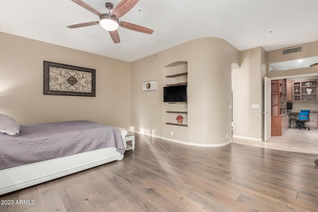 bedroom with hardwood / wood-style flooring and ceiling fan