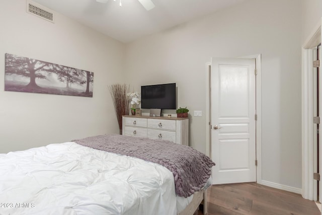 bedroom featuring lofted ceiling, hardwood / wood-style floors, and ceiling fan