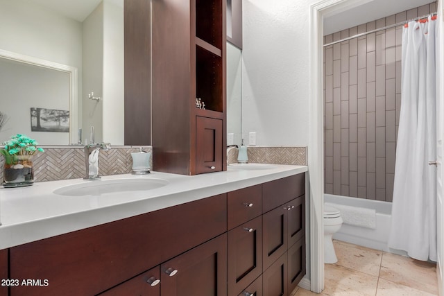 full bathroom featuring shower / tub combo with curtain, toilet, vanity, tile patterned flooring, and backsplash