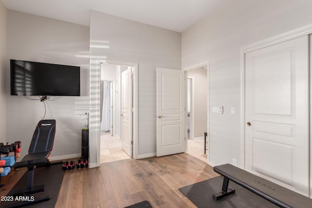 exercise room featuring light hardwood / wood-style flooring