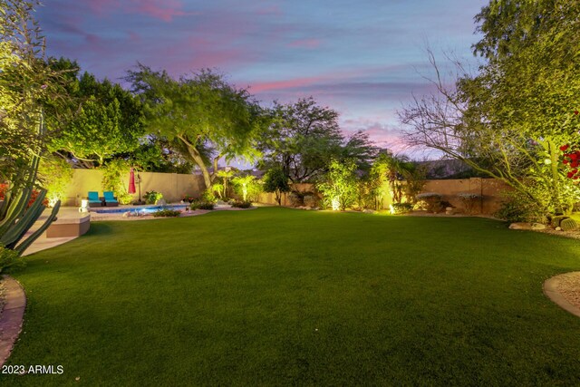 yard at dusk with a pool