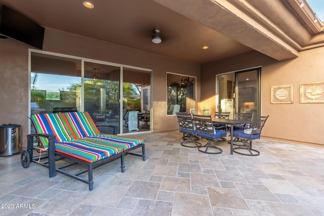 view of patio featuring ceiling fan