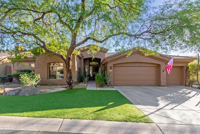 mediterranean / spanish home with a garage and a front lawn