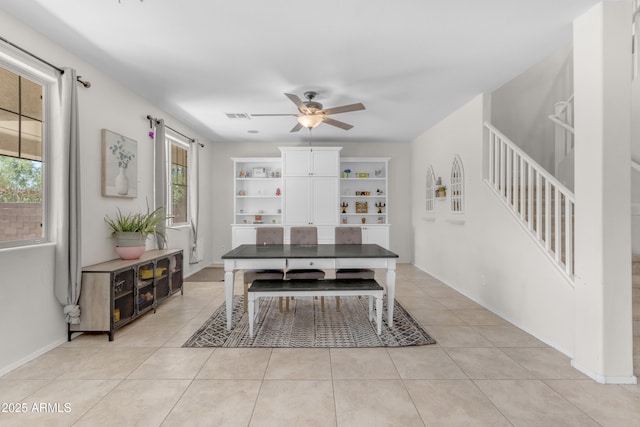 27053 N 172nd Ln, Surprise, AZ 85387 - dining room featuring a ceiling fan, stairway, and light tile patterned floors