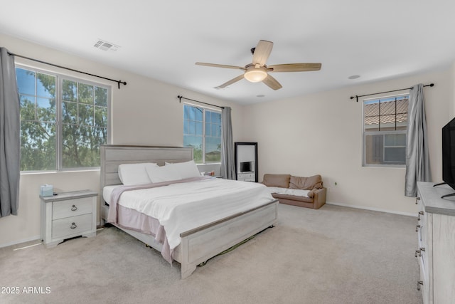 27053 N 172nd Ln, Surprise, AZ 85387 - bedroom featuring multiple windows, light colored carpet, and ceiling fan
