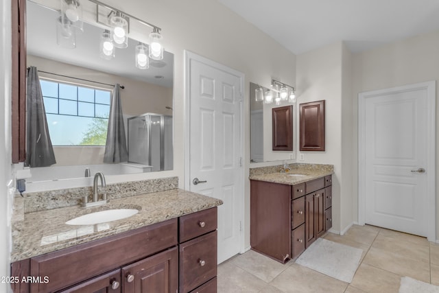27053 N 172nd Ln, Surprise, AZ 85387 - full bathroom with a shower stall, two vanities, and tile patterned flooring