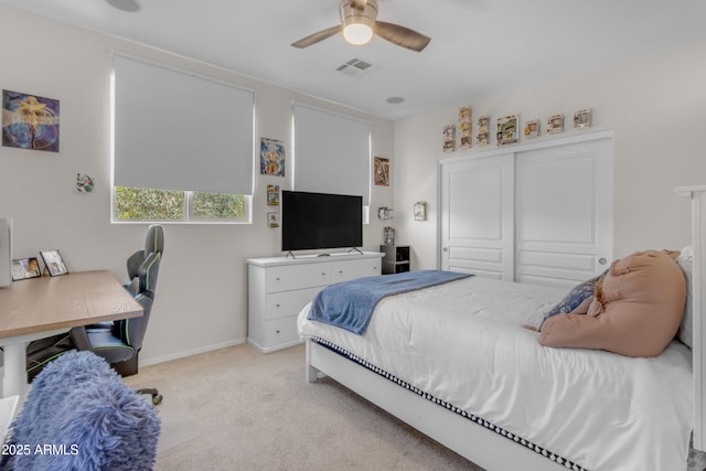 27053 N 172nd Ln, Surprise, AZ 85387 - bedroom with light colored carpet, ceiling fan, and a closet