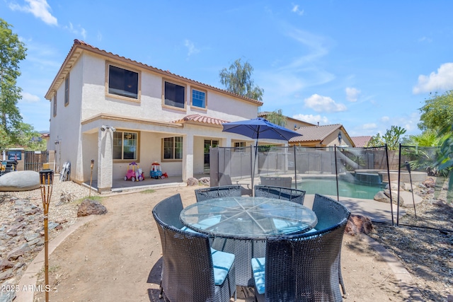 27053 N 172nd Ln, Surprise, AZ 85387 - rear view of house with stucco siding, a patio area, a fenced backyard, a tiled roof, and a pool with connected hot tub