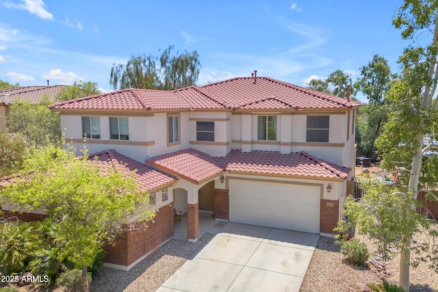27053 N 172nd Ln, Surprise, AZ 85387 - mediterranean / spanish-style home featuring brick siding, driveway, stucco siding, and a tile roof