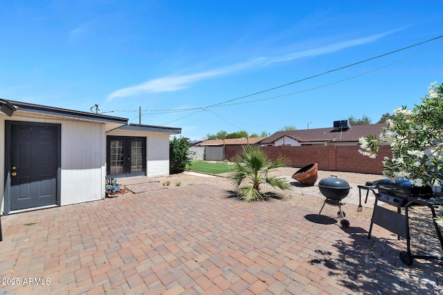 view of patio / terrace featuring a fenced backyard and french doors