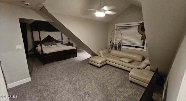 carpeted bedroom with ceiling fan and vaulted ceiling