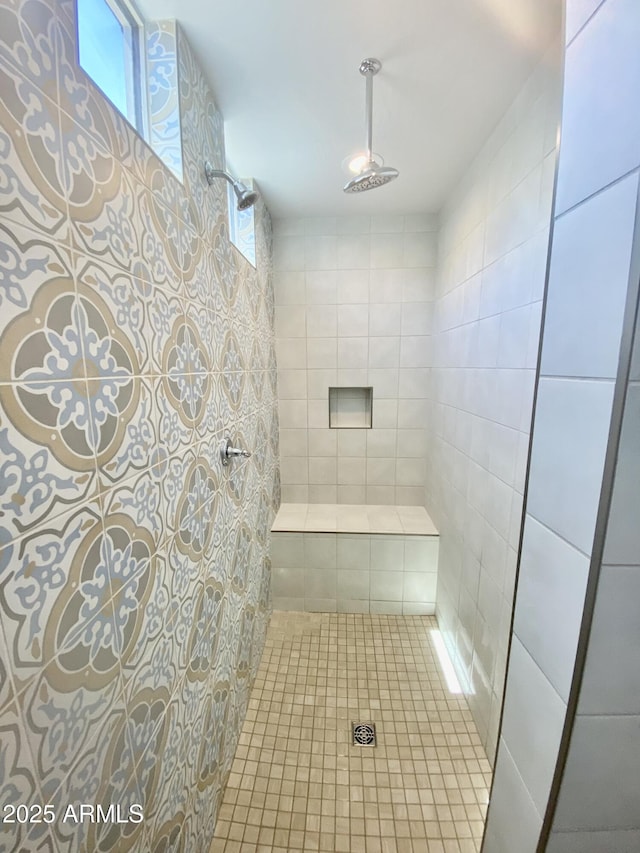 bathroom with tiled shower