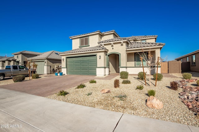 mediterranean / spanish house featuring a garage