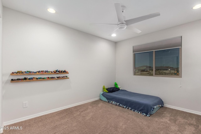 bedroom with ceiling fan and carpet floors