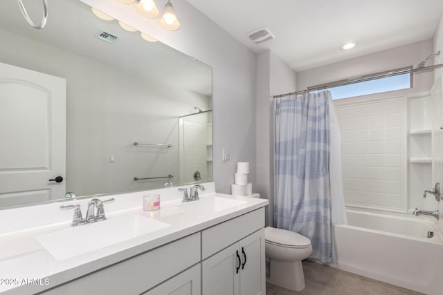 full bathroom with tile patterned flooring, toilet, vanity, and shower / bath combo with shower curtain