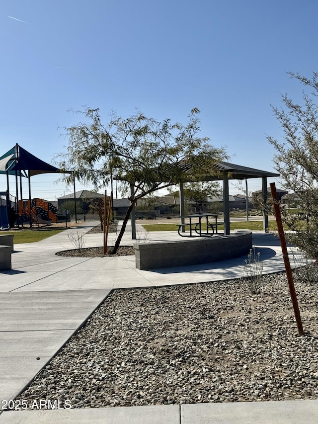 view of community featuring a playground and a gazebo