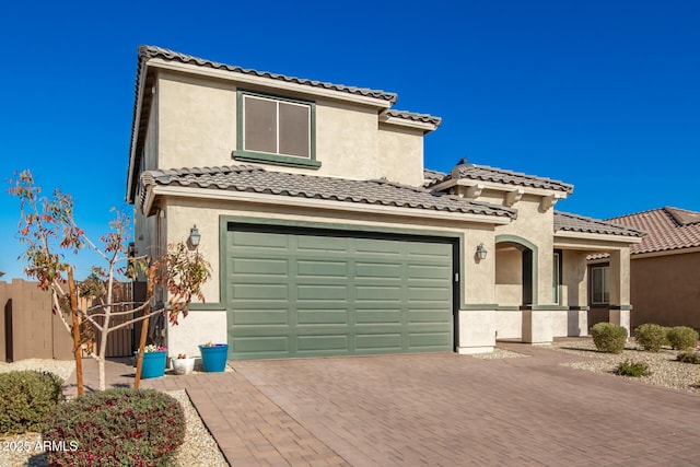 mediterranean / spanish-style house featuring a garage