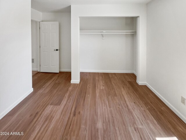 empty room featuring wood-type flooring