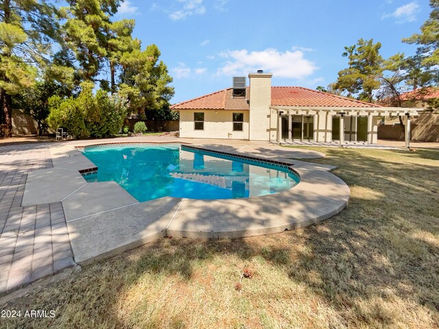 view of yard featuring a fenced in pool and a patio