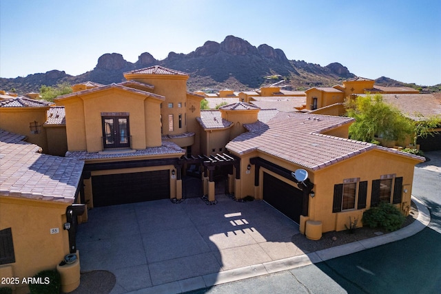 5370 S Desert Dawn Dr Unit 56, Gold Canyon, AZ 85118 - view of front facade with a mountain view, french doors, stucco siding, driveway, and a tile roof