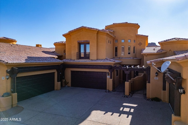5370 S Desert Dawn Dr Unit 56, Gold Canyon, AZ 85118 - view of front of house with driveway, a gate, stucco siding, a tile roof, and french doors