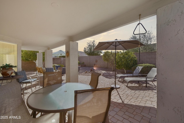 view of patio / terrace featuring outdoor dining area and a fenced backyard