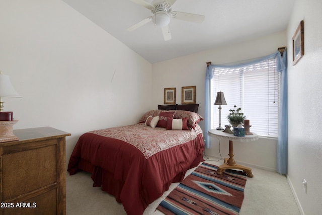 bedroom with a ceiling fan, light colored carpet, and baseboards