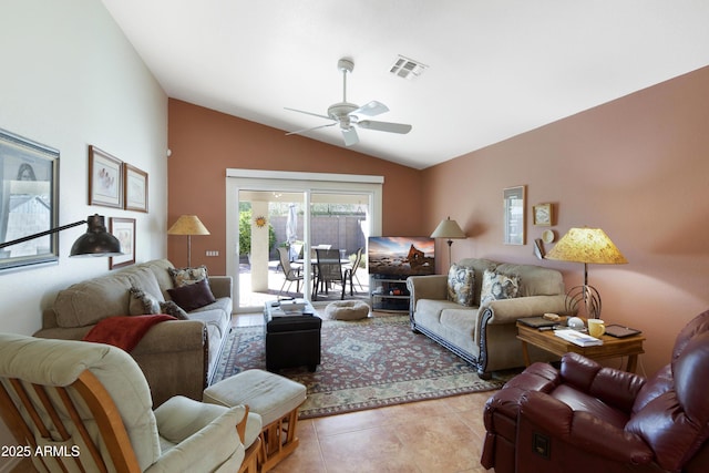 living area featuring lofted ceiling, light tile patterned flooring, a ceiling fan, and visible vents